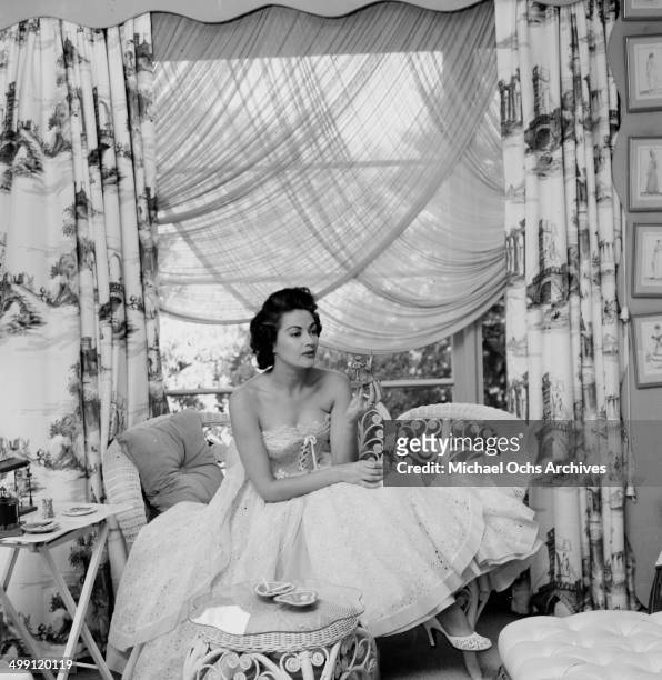 Actress Yvonne De Carlo poses at home in Los Angeles, California.
