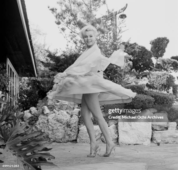 March 23, 1956: Actress Zsa Zsa Gabor poses during a photo shoot at home in Los Angeles, California.