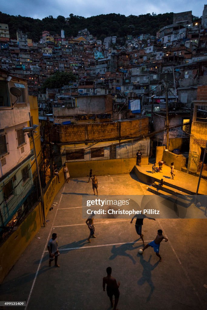 Boys play football in favela, Rio de Janeiro