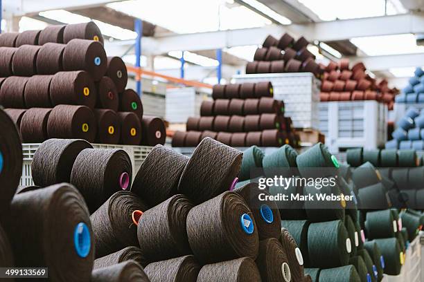 reels of wool in storage room in woollen mill - textile industry uk stock pictures, royalty-free photos & images