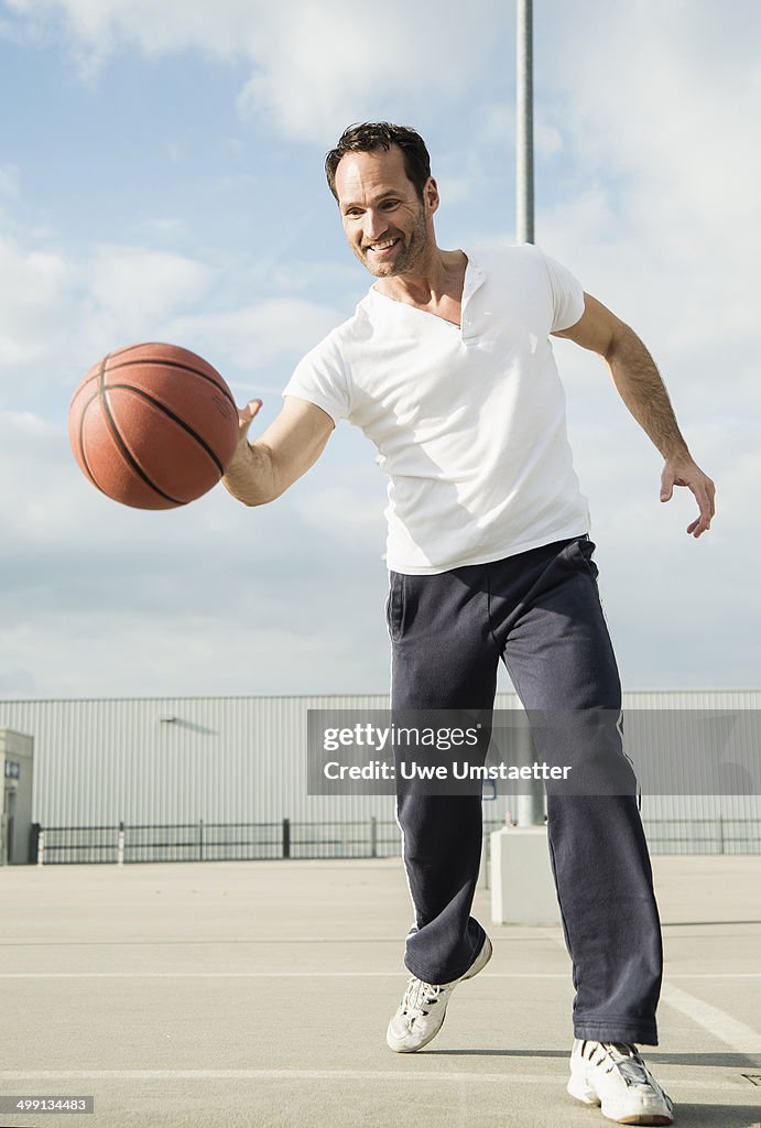 Basketball player dribbling basketball