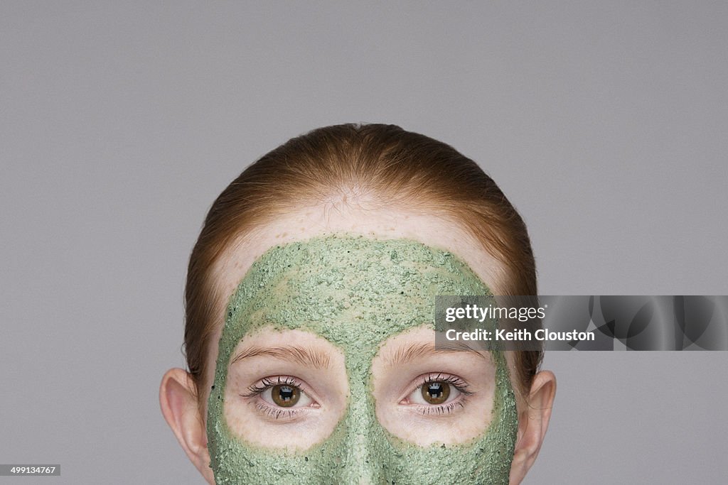 Cropped image of young woman wearing face mask