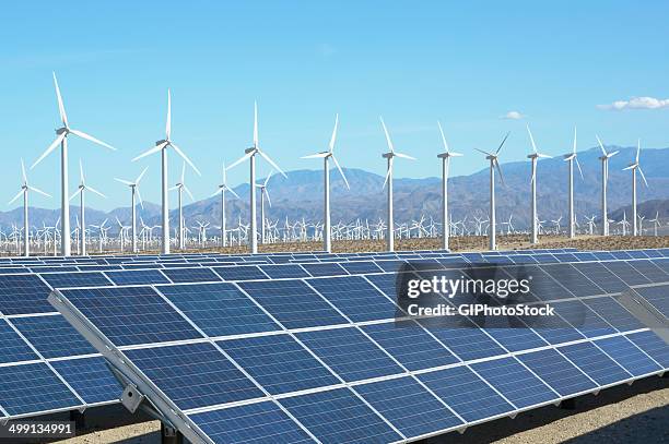 photovoltaic solar panels and wind turbines, san gorgonio pass wind farm, palm springs, california, usa. this solar installation has a 2.3 mw capacity - wind turbine california stock pictures, royalty-free photos & images