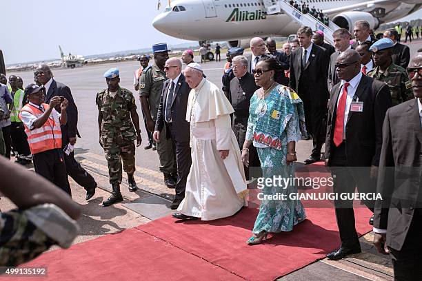 Central African Republic interim president Catherine Samba-Panza welcomes Pope Francis upon his arrival on November 29, 2015 in Bangui, Central...