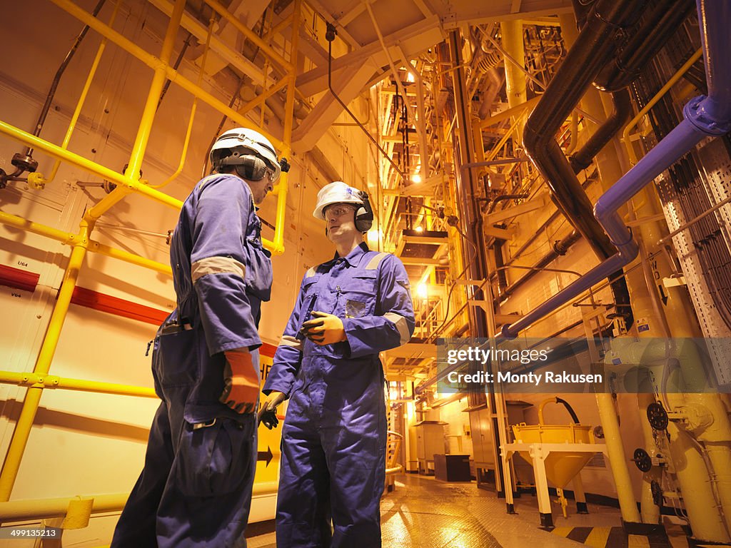 Engineers in meeting near reactor hall of nuclear power station