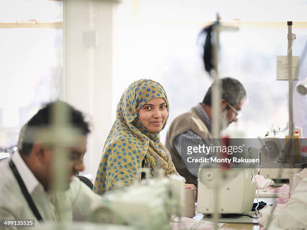 female worker in garment factory, portrait - indian textile stock pictures, royalty-free photos & images