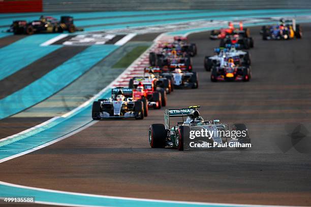 Nico Rosberg of Germany and Mercedes GP leads Lewis Hamilton of Great Britain and Mercedes GP and Kimi Raikkonen of Finland and Ferrari as Fernando...