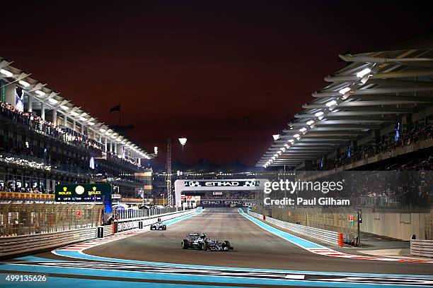 Nico Rosberg of Germany and Mercedes GP leads Lewis Hamilton of Great Britain and Mercedes GP during the Abu Dhabi Formula One Grand Prix at Yas...