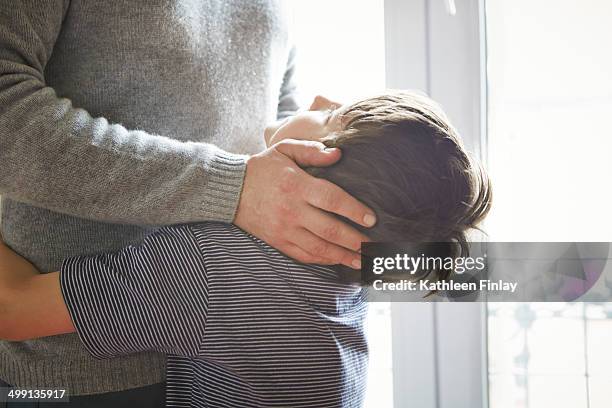 father and son hugging - tag 7 bildbanksfoton och bilder
