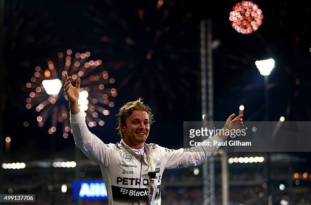Nico Rosberg of Germany and Mercedes GP celebrates in Parc Ferme after winning the Abu Dhabi Formula One Grand Prix at Yas Marina Circuit on November...