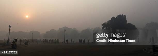 Runners take part in Airtel Delhi Half Marathon 2015 at Rajpath in the foggy weather on November 29, 2015 in New Delhi, India. This year Delhi half...