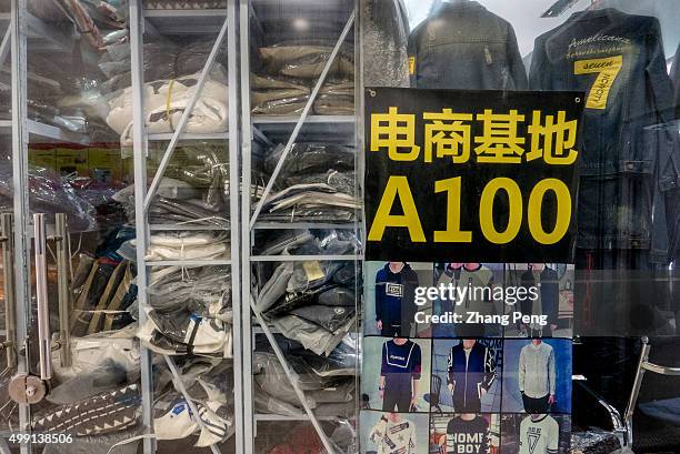 Goods shelves of a wholesale booth in the e-commerce base in Hangzhou, where wholesalers supply clothes goods for Taobao shop owners. Taobao, founded...