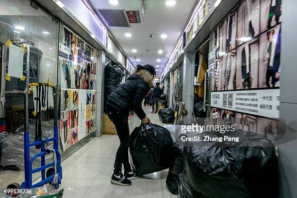 Ordered goods are packed and piled outside the booth, waiting to be delivered to customers by logistics. An e-commerce base in Hangzhou, where...