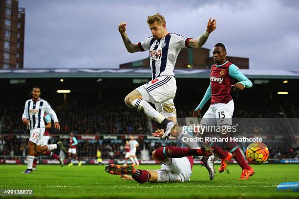 James McClean of West Bromwich Albion is tackled by Carl Jenkinson of West Ham United during the Barclays Premier League match between West Ham...