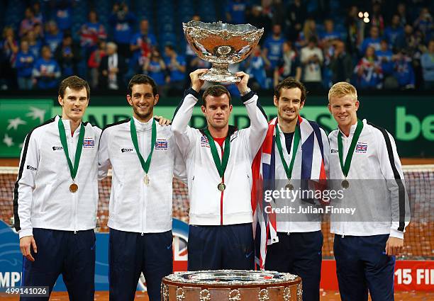 Jamie Murray, James Ward, Leon Smith, Andy Murray and Kyle Edmund of Great Britain celebrate with the Davis Cup following victory on day three of the...