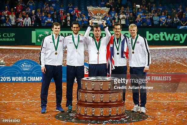 Jamie Murray, James Ward, Leon Smith, Andy Murray and Kyle Edmund of Great Britain celebrate with the Davis Cup following victory on day three of the...