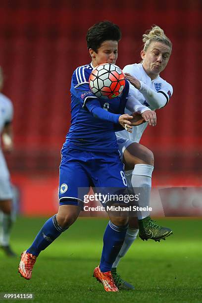 Laura Bassett of England challenges Aida Hadzic of Bosnia and Herzegovina during the UEFA Women's Euro 2017 Qualifier match between England and...