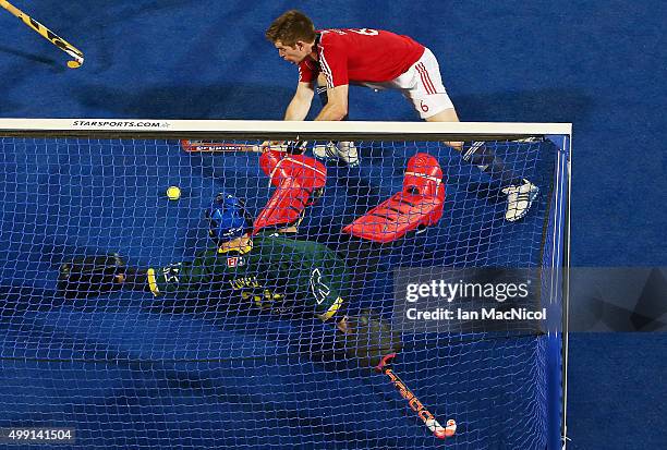 Henry Weir of Great Britain scores during the match between Australia and Great Britain on day three of The Hero Hockey League World Final at the...