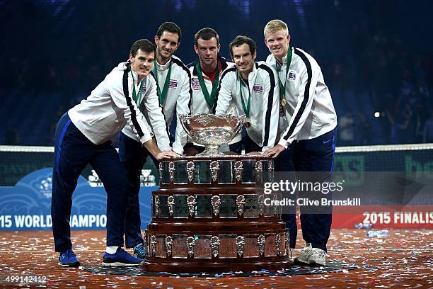 Jamie Murray, James Ward, Leon Smith, Andy Murray and Kyle Edmund of Great Britain pose with the Davis Cup following victory on day three of the...