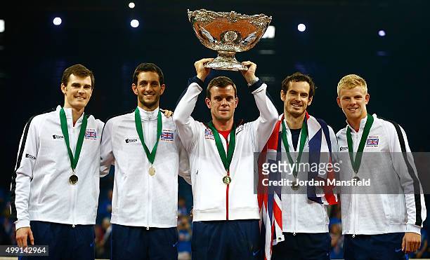 Great Britain Captain Leon Smith lifts the trophy with his team Jamie Murray, James Ward, Andy Murray and Kyle Edmund following their victory during...