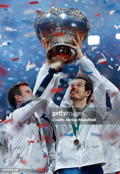 Great Britain Captain Leon Smith lifts the trophy with Andy Murray following their victory during day three of the Davis Cup Final match between...