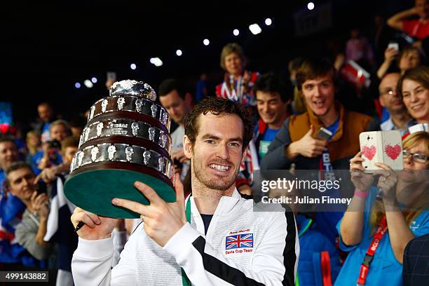 Andy Murray of Great Britain poses with his trophy following victory on day three of the Davis Cup Final 2015 at Flanders Expo on November 29, 2015...