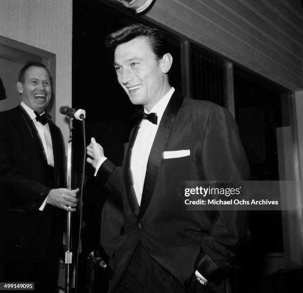 Actor Laurence Harvey attends a party in Los Angeles, California.