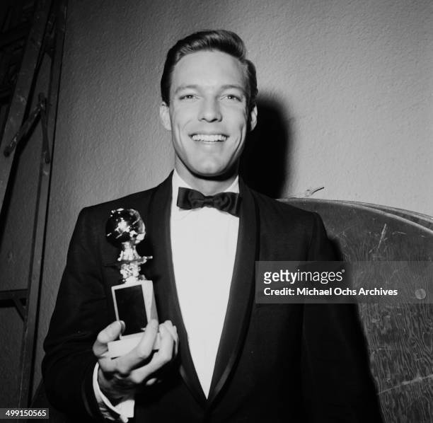 Actor Richard Chamberlain poses with his Golden Globe Award for Best Actor  Television Series Drama for "Dr. Kildare" in Los Angeles, California.