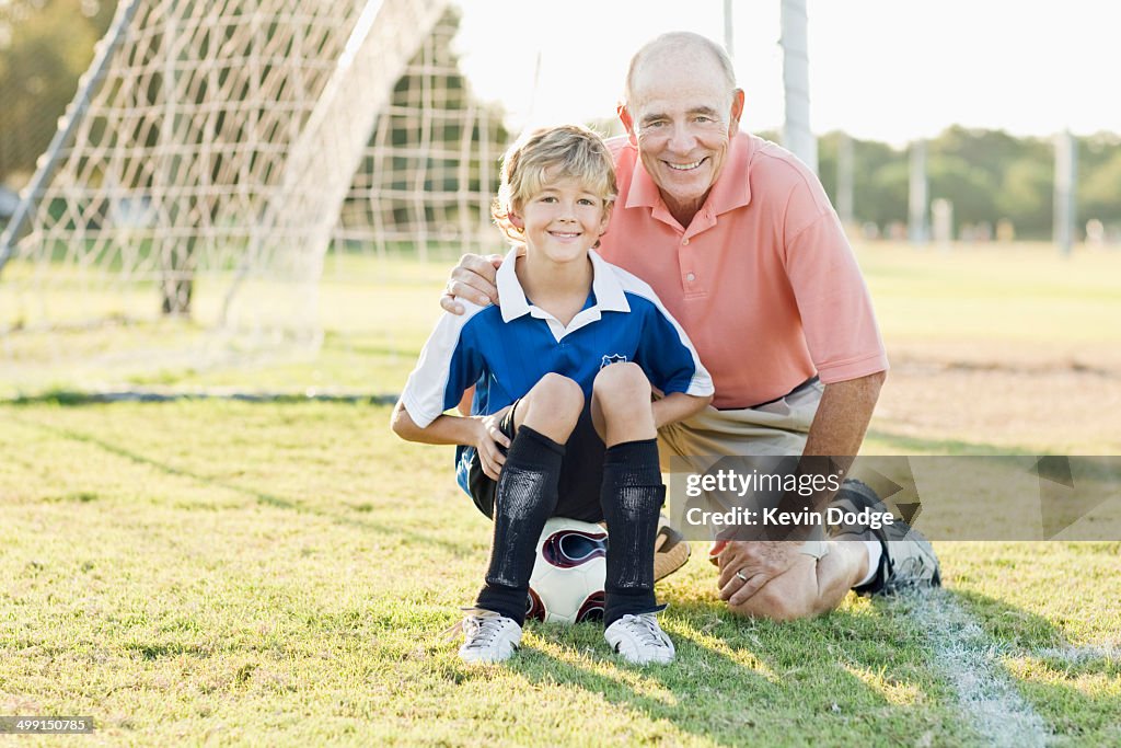 Grandfather and Grandson on Soccer Field