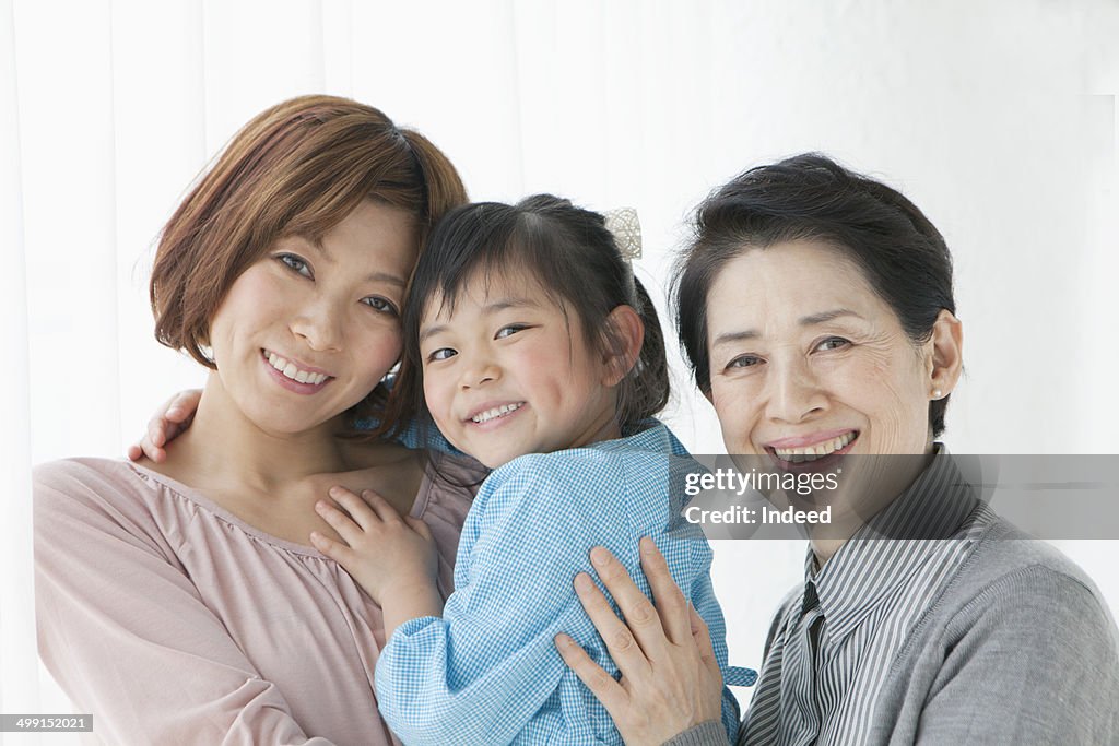 60th generation woman standing with her daughter and grand daughter