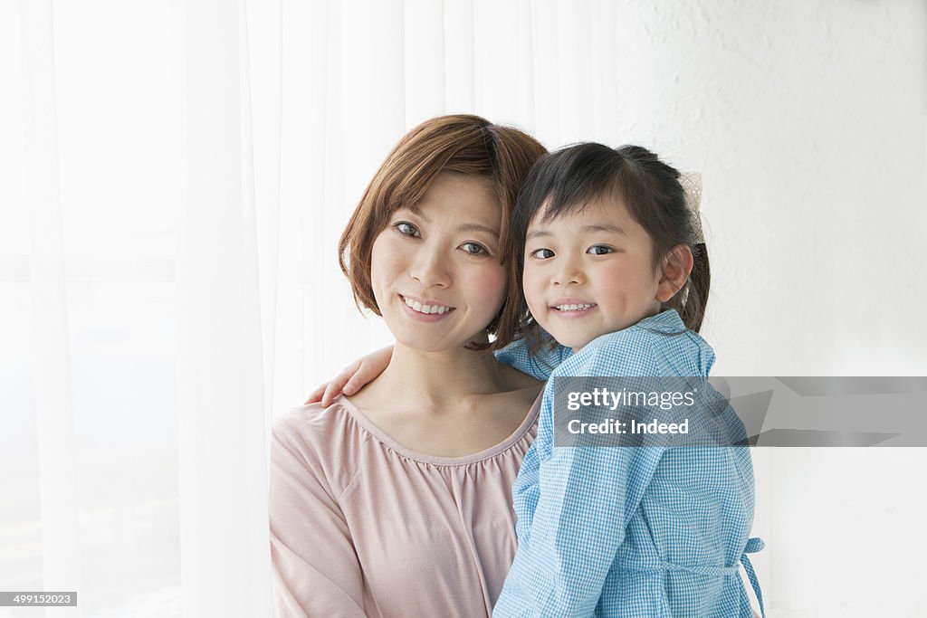 20th generation woman hugging her daughter