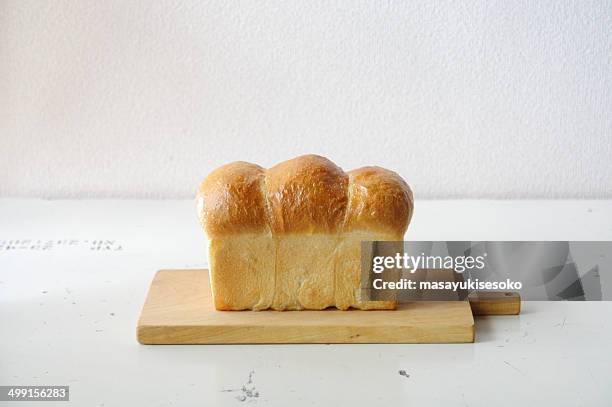 loaf of bread on cutting board - loaf of bread ストックフォトと画像