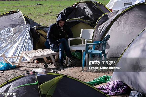 Stranded migrant rests at a makeshift camp next to the Greek-Macedonian border near the Greek village of Idomeni on November 29, 2015 near Idomeni,...