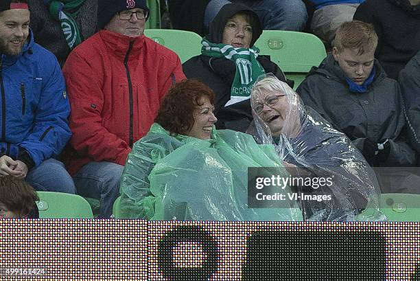 Den Haag, regen, bescherming, regenpak, dames during the Dutch Eredivisie match between FC Groningen and ADO Den Haag at Euroborg on November 29,...