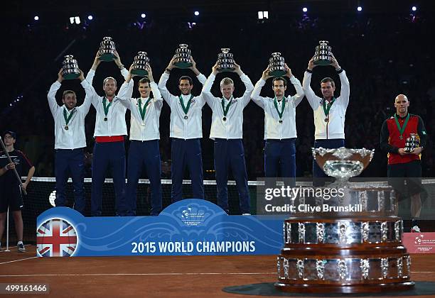 Dan Evans, Dom Inglot, Jamie Murray, James Ward, Kyle Edmund, Andy Murray and Leon Smith of Great Britain celebrate with their trophies following...