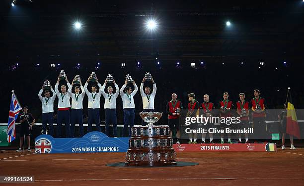 Dan Evans, Dom Inglot, Jamie Murray, James Ward, Kyle Edmund, Andy Murray and Leon Smith of Great Britain celebrate with their trophies following...