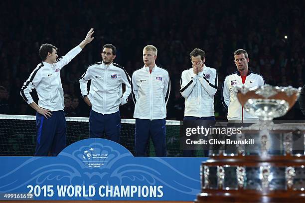 Jamie Murray, James Ward, Kyle Edmund, Andy Murray and Leon Smith of Great Britain prepare to receive their trophies following victory on day three...
