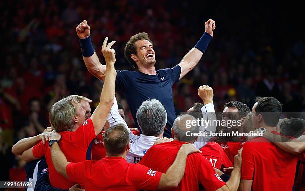 Andy Murray of Great Britain celebrates with his team-mates after winning his match to win the Davis Cup for Great Britain during day three of the...