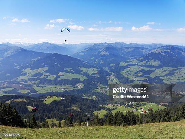 austria, tyrol, kitzbuehel alps, view from hohe salve to brixen valley with hopfgarten, paraglider - hopfgarten stock pictures, royalty-free photos & images