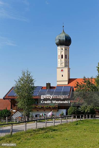 germany, upper bavaria, bavaria, waakirchen, solar cells on farmhouse, st martin's church tower - st martins in the fields church stock pictures, royalty-free photos & images