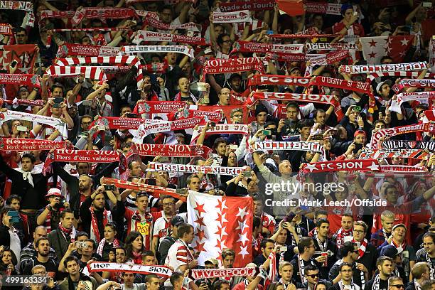 Sion fans hold their scarves aloft during the UEFA Europa League Group B match between Liverpool and FC Sion on October 1, 2015 in Liverpool, England.