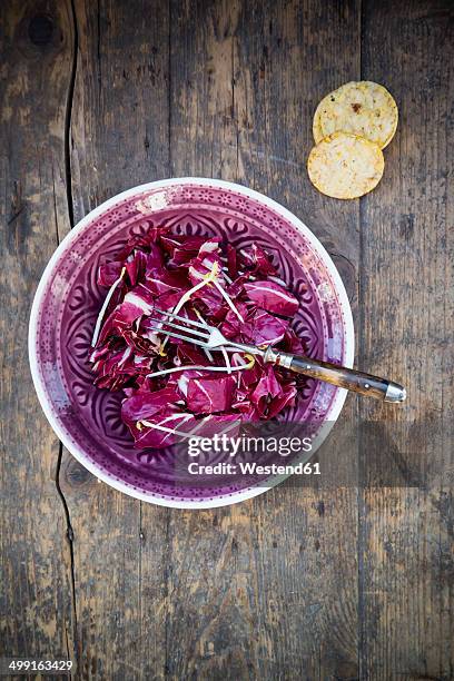 radicchio salad with pea sprouts in a bowl and rosemary-corn waffles - radicchio stock-fotos und bilder