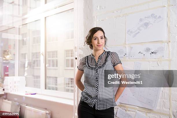 portrait of young female architect in office - sketch young woman stock pictures, royalty-free photos & images