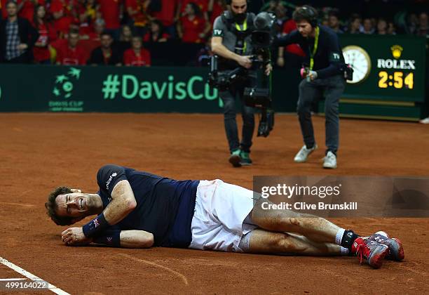 Andy Murray of Great Britain celebrates winning his singles match against David Goffin of Belgium and clinching the Davis Cup on day three of the...