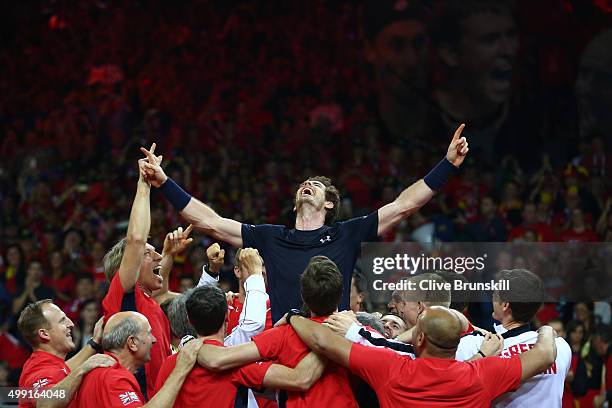 Andy Murray of Great Britain celebrates with his team after winning his singles match against David Goffin of Belgium and clinching the Davis Cup on...