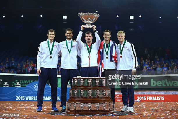 Jamie Murray, James Ward, Leon Smith, Andy Murray and Kyle Edmund of Great Britain celebrate with the Davis Cup following victory on day three of the...