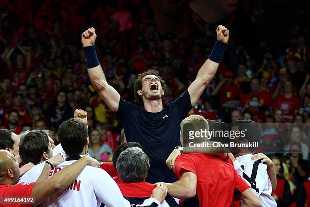 Andy Murray of Great Britain celebrates with his team after winning his singles match against David Goffin of Belgium and clinching the Davis Cup on...