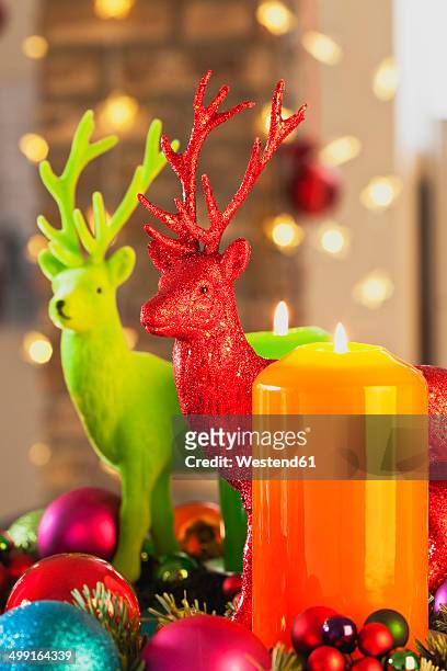colourful advent wreath with candles and toy deers - kitsch stock pictures, royalty-free photos & images