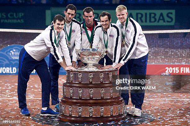 Britain's Jamie Murray, Britain's James Ward, Britain's captain Leon Smith, Britain's Andy Murray and Britain's Kyle Edmund pose with the trophy...