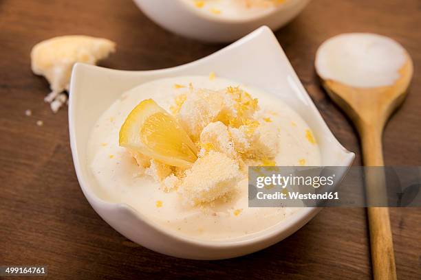 bowl of lemon curd creme with crumbled meringues - curd cheese stock pictures, royalty-free photos & images